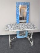 A wrought iron mosaic topped table together with an Ikea mirror