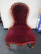A Victorian mahogany lady's chair in maroon buttoned dralon