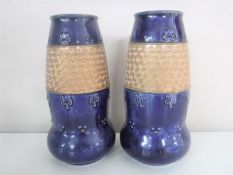 A pair of Royal Doulton glazed pottery vases,