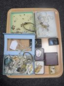 A tray of costume jewellery including brooches, earrings,