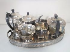 A silver plated gallery tray containing a Sheffield plate four piece tea service and a Cameo three