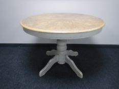 A circular pedestal extending kitchen table