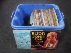 A crate of vinyl LP records including Elton John, ABBA, Rod Stewart,