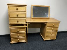 A contemporary four drawer pedestal dressing table with mirror together with a pair of matching