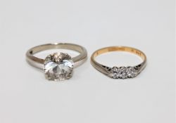 An 18ct gold and platinum three stone diamond ring,