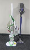 A Morphy Richards steam cleaner together with a Dyson DC45 hand held vacuum with accessories