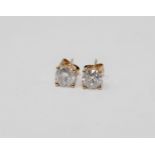 A pair of 14ct yellow gold diamond stud earrings, featuring two round brilliant cut diamonds 1.45ct.