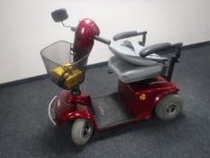 A Free Rider disability scooter with key (with charger but lacking batteries)