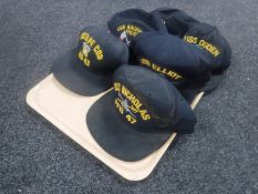 A tray of six US navy caps
