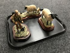 Three Border Fine Arts figures - Shepherd with sheep dog, Sheep on wooden bases.