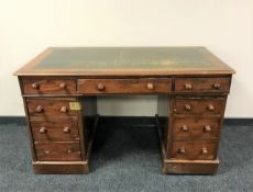 A Victorian mahogany twin pedestal desk fitted nine drawers