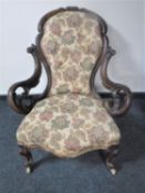 A Victorian mahogany lady's chair upholstered in floral fabric
