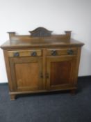 An oak Arts and Crafts sideboard