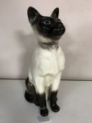 A Beswick figure of a seated Siamese cat, no.