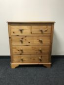 A pine five drawer chest