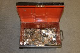 A large vintage tin containing a large quantity of pre-decimal coins