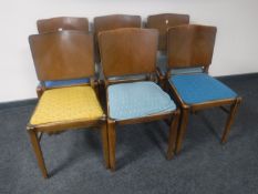A set of six mid twentieth century oak panel backed dining chairs
