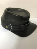 An antique leather cap