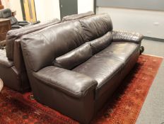 A contemporary brown leather three seater settee, length 210 cm.