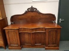 A Victorian mahogany serpentine fronted sideboard,