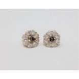 A pair of 18ct yellow gold diamond stud earrings featuring two round brilliant cut cognac diamonds