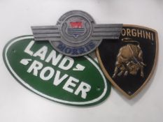 Three cast iron plaques - Land Rover,