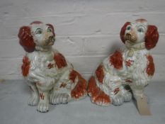 A pair of Staffordshire spaniels, height 28 cm.