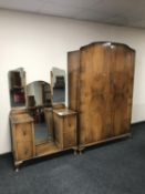 A walnut Art Deco double door wardrobe together with a sunk centre dressing table