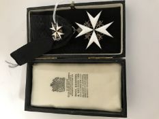 A white enamel medal with miniature on black ribbon in Toye, Kenning & Spencer case.