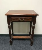 An Indonesian mahogany side table fitted a drawer