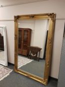 A Victorian style gilt framed overmantel mirror 113 cm x 175 cm
