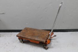 A flatbed trolley with hydraulic lift (a/f)