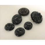 A bag of six Whitby jet brooches