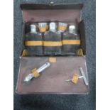 A vintage leather cased drinks set CONDITION REPORT: The case measures 30cm by 19cm