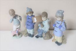 Four Nao figures of boys