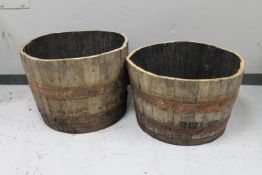 A pair of antique oak coopered barrel planters