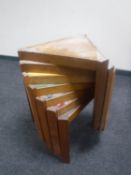 A nest of seven mid twentieth century triangular stackable tables