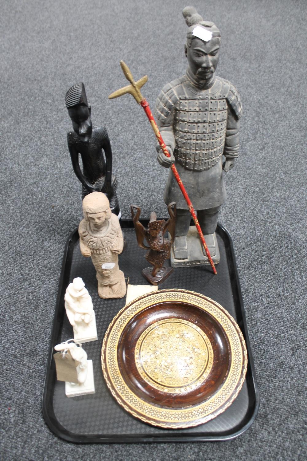 A tray of tourist pieces to include Chinese soldier, inlaid hardwood wall plaque,
