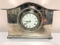 A French silver plated mantel clock on bun feet, retailed by Liberty & Co. London