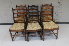 A set of six oak ladder back dining chairs