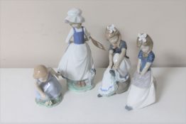 Four Nao figures of girls