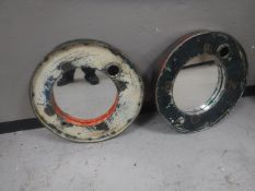 A pair of metal oil drum topped mirrors