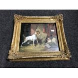 A gilt framed antiquarian oil on board depicting a dog stalking a cat