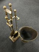 An early 20th century four piece brass companion set on stand together with a brass coal bucket