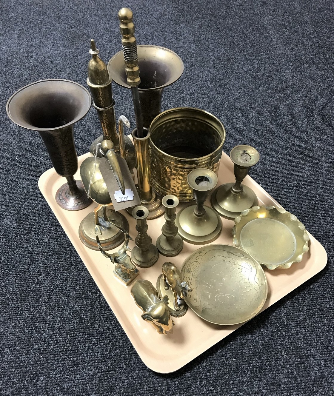 A tray containing assorted brass ware to include pair of Eastern brass vases and teapot,