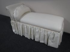 A 20th century storage chaise longue in cream fabric