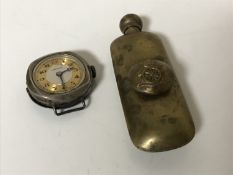 A WWI brass artillery oiler together with a WWI silver trench watch