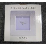 Four boxed Royal Crest mirror clocks together with two Leonardo collection silver glitter clocks