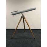 A 1920's chrome telescope with two lenses and 5' wooden tripod stand