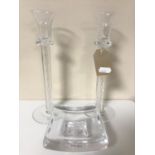 A pair of Kosta Boda twist stem glass candlesticks together with a glass ashtray